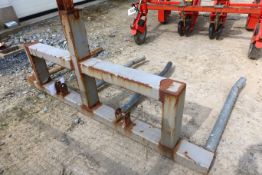 Metal twin bar round bale lifter attachment.