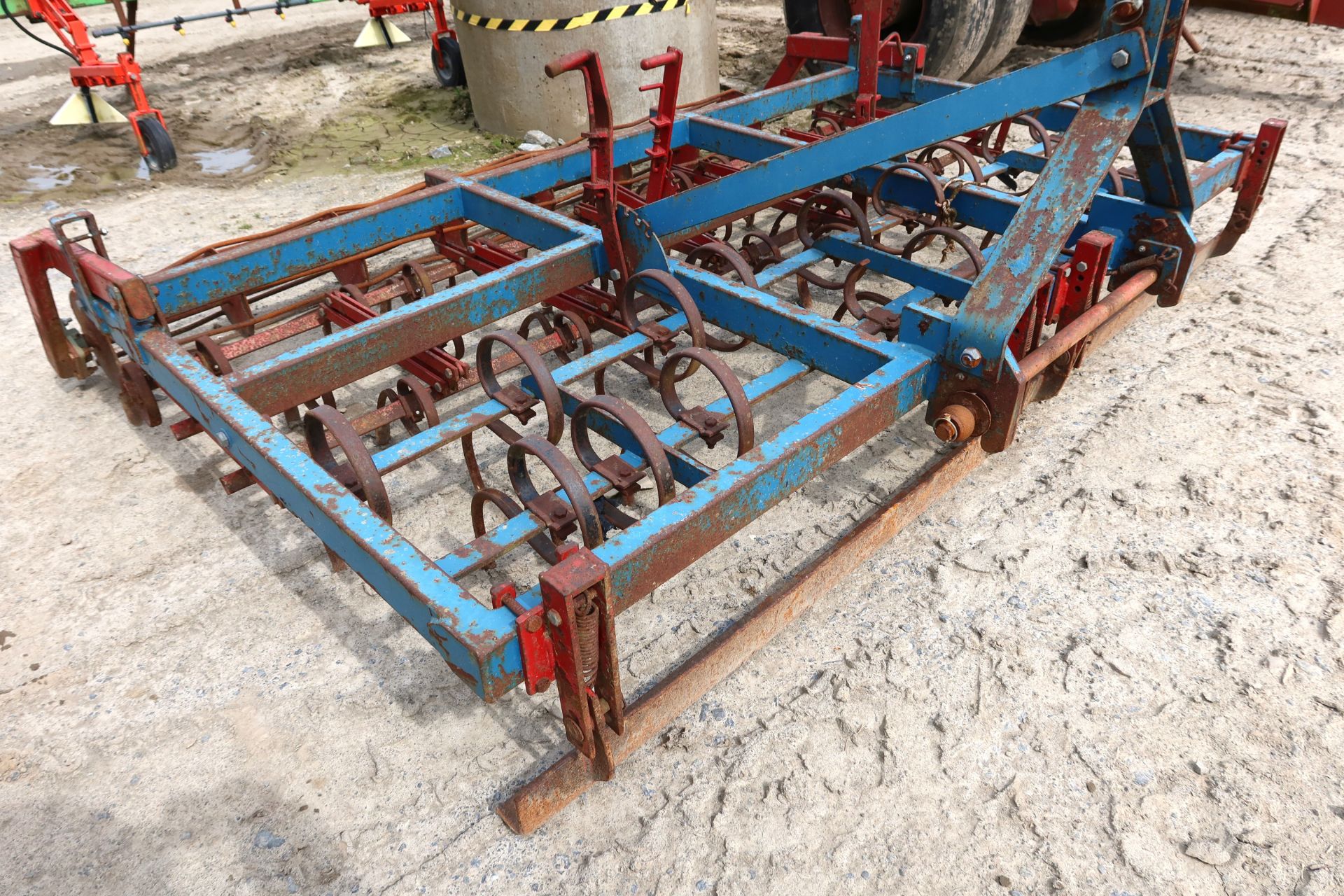 Metal framed spring tine cultivator with crumbler, 9' width.