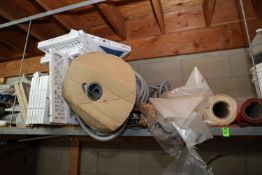 Contents on top shelf including filters and plastic sheeting