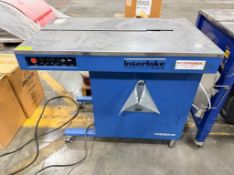 DESCRIPTION INTERLAKE P-555 SEMI-AUTOMATIC STRAPPING MACHINE. BRAND/MODEL: INTERLAKE P-555 INFORMATI