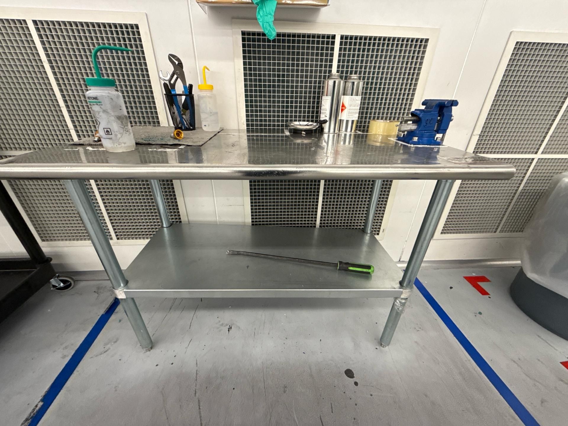 Stainless steel table with bench vise