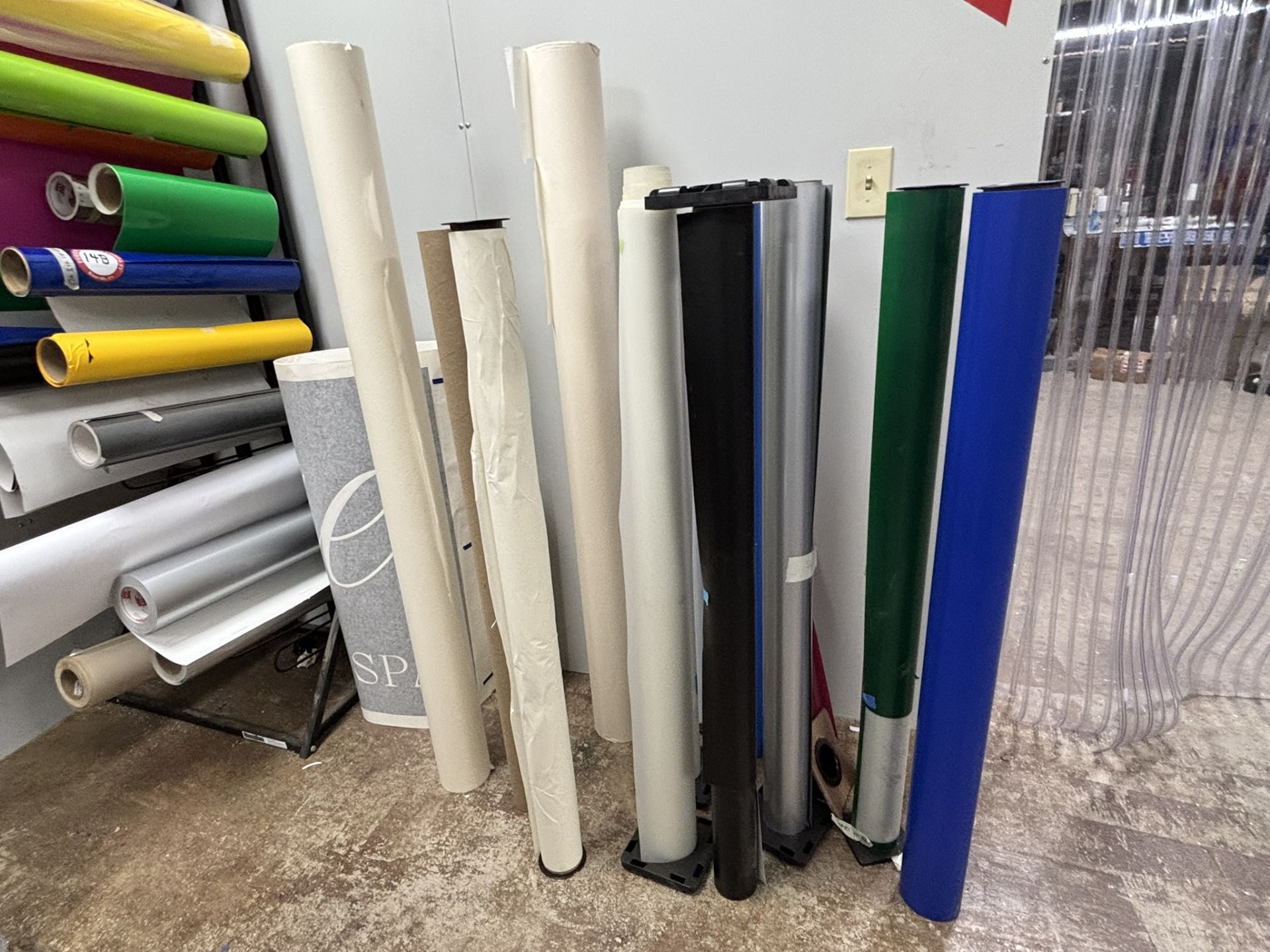 Approximately 38 Partial Rolls of Vinyl, Assorted Sizes, Assorted Colors, Plus Rolled Vinyl