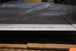 BLACK METAL PROTECTIVE COVER AND HINGED PROTECTIVE DOOR