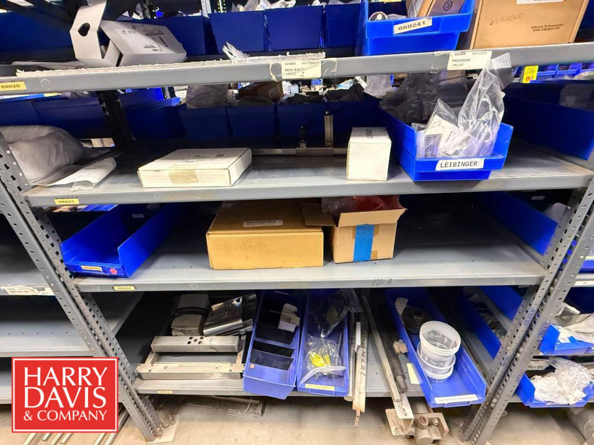 Zebra Printer Rack Rack with Assorted Zebra Printer Parts, Including: Media Kits, Drive ...