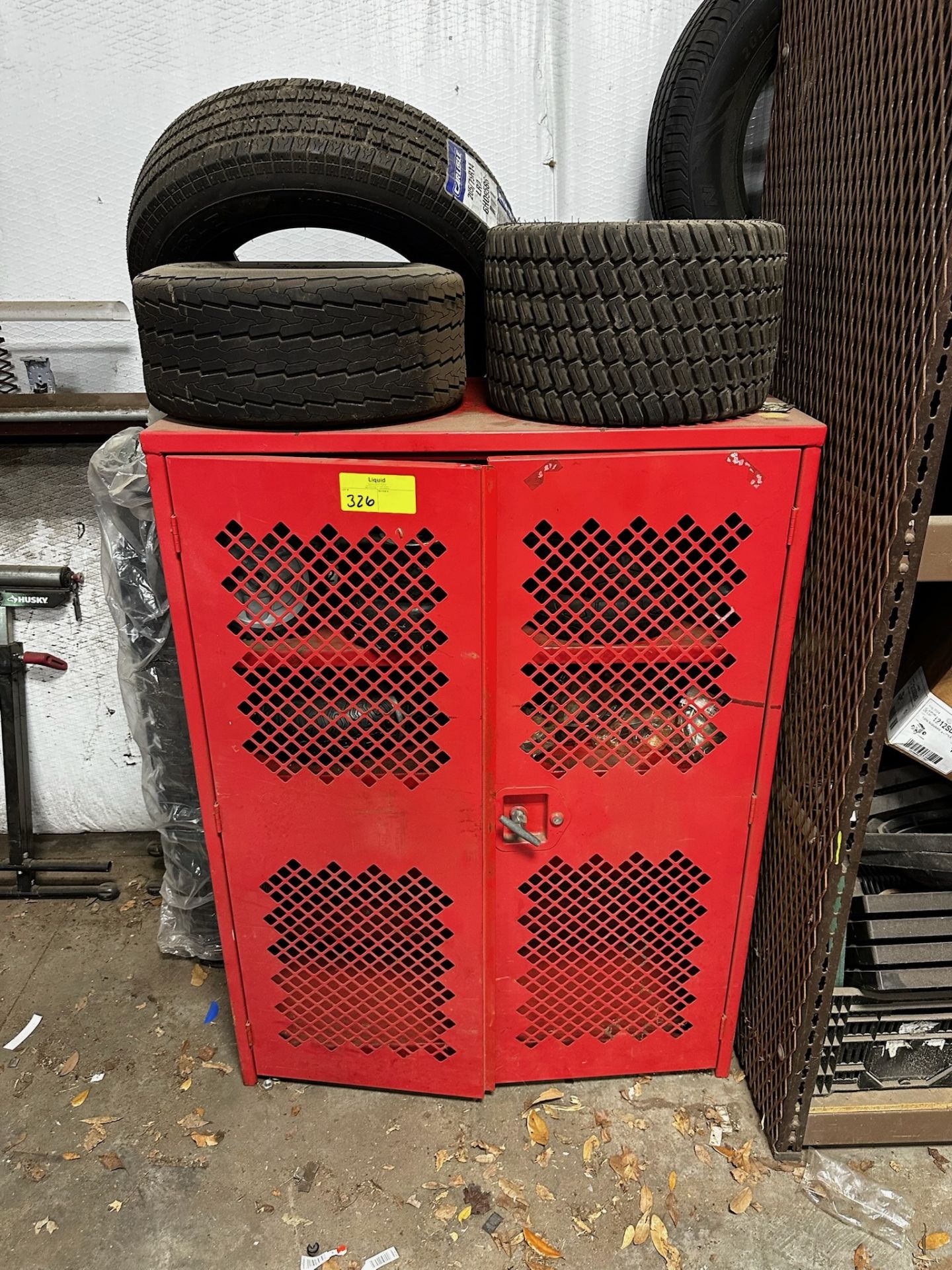 Metal Shop Storage Cabinet with Tires and Parts