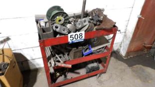 Red Three-Tier Utility Cart with Assorted Metal Parts, Industrial Tools, and Components