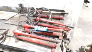 Hydraulic Cylinders and Hoses, Assorted Red and Black Units, Multiple Sizes
