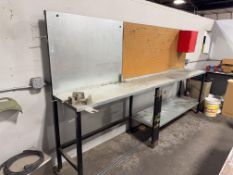 Industrial Workbench with Pegboard and Red Storage Cabinet