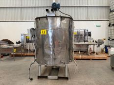 Stainless steel jacketed industrial mixing tank, With a capacity of approximately 800 liters. Equip