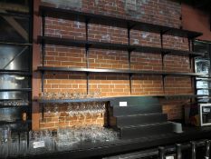 Wall shelving behind bar