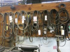 Large Lot of Belts on Wall