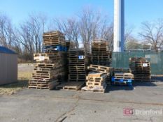 Lot of Standard and Paper Sized Wooden Pallets Located Outside