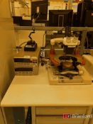 Rucker & Kolls R-Tester; Model: 260. Bausch & Lomb Stereo Zoom Microscope.