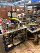 (3) Metal Work Tables in Casters w/ Various Spare Parts