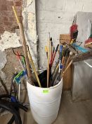 Barrel with miscellaneous rakes, brooms etc…