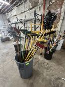Barrel with miscellaneous items: Paint rollers, brooms, pry bar, scraper etc…
