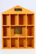 Steiff - A wooden Steiff display case 'Ten Decades, Famous Steiff Teddy Bears'.