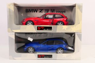 UT Models - A pair of boxed 1/18 scale d