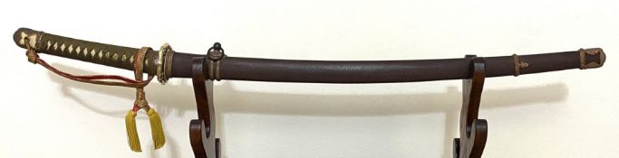 A WWII Japanese Sword with Silver Mon and Gold Coloured Tassel. A WWII Japanese Army officer's sword