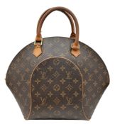 A Louis Vuitton Brown Monogram Ellipse Handbag. Brown Monogram coated canvas exterior with gold-