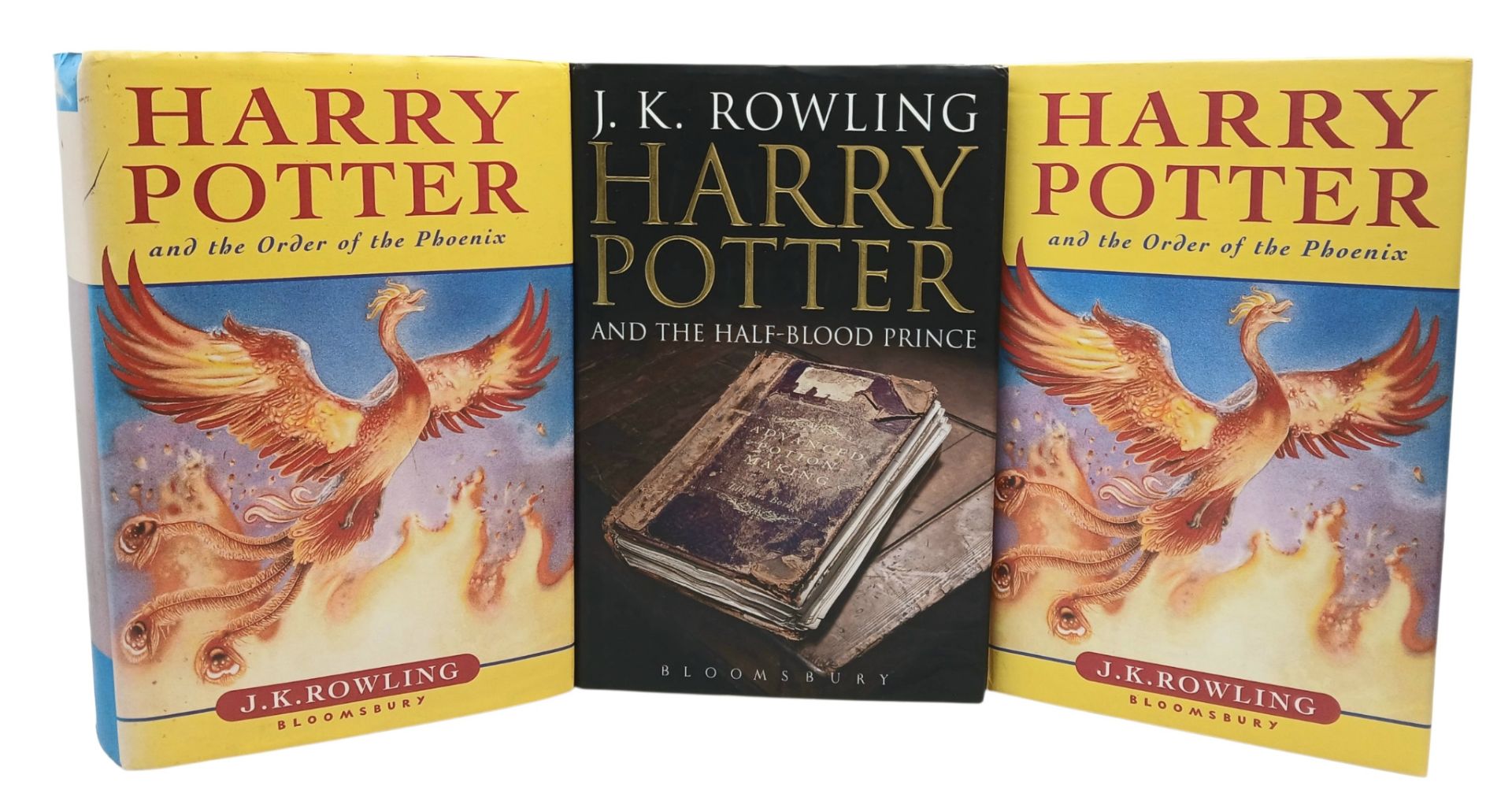 A Parcel of Three First Edition Harry Potter Books Including the misprint edition of Harry Potter