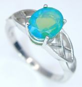 An Attractive Sterling Silver and Opal Set Celtic Design Ring Size S. The Ring is set with an 8 x
