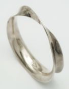 A Mexican 925 silver twisted bangle. Total weight 45.9G. Diameter 7.3cm.