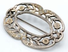 A Vintage Silver Floral Brooch with Crystal Set Detail. Approx 5.5cm x 3.5cm. 13.23g. Comes with a