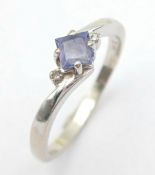 14 CARAT WHITE GOLD and TANZANITE RING. Diamond Point Side Detail. 2.26 Grams. Size N.