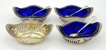 Four Antique 800 Silver Condiment Bowls with Silver Spoons and Three Blue Glass Liners. Comes in