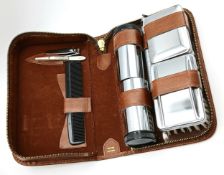 A vintage travel Grooming kit in a zipped leather case. Please see photos for details.