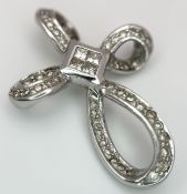 AN 18K WHITE GOLD, DIAMOND SET, FANCY CROSS PENDANT. 0.50CT WEIGHT. TOTAL WEIGHT 5.4G. SC 9072