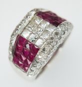 An 18K White Gold, Diamond and Ruby Cocktail Ring. Princess cut stones in a stylish setting. c 1.