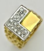 A Statement 18K Yellow Gold and Diamond Gents Signet Ring. Dimple effect band with an 'L' shaped