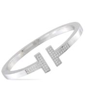 An 18K White Gold 0.74ct Diamond Tiffany & Co. T Bracelet Size Large. Diamonds totaling 0.74