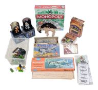 A mixed lot of toys and games. To include Britains and Monopoly. Please see photos for finer