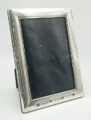 A vintage sterling silver picture frame. 14 X 19 cm
