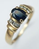 A 9K Yellow Gold Diamond and Sapphire Ring. Size K 1/2. 2.2g.
