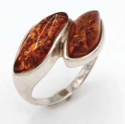 A 925 Silver and Amber Crossover Ring. Size P1/2, 4.83g total weight.