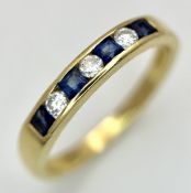 AN 18K YELLOW GOLD, DIAMOND AND SAPPHIRE SET, CHANNEL SET, HALF ETERNITY RING. 3.1G, SIZE N. TAN