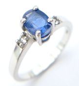 A Sterling Silver Kyanite and White Topaz Set Ring Size N. The Ring is set with a 7 x 5mm Blue
