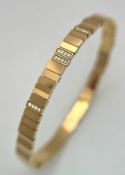 A Dior 18K rose gold and diamond bangle. Total weight 19.676G. Measure: 6cmx4cm. Comes with card