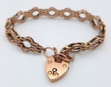 A Vintage 9K Yellow Gold Fancy Gate Bracelet with Heart Clasp. 17cm. 13g.