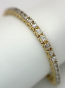 A 14K YELLOW GOLD, DIAMOND SET, TENNIS / LINE BRACELET. APPROX 3CTW. 13G. SC 2061