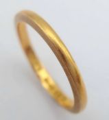 A 22K Yellow Gold Band Ring. UK hallmarks. 3mm width. Size L. 2.65g.