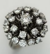 An 18k Gold and Diamond Starburst Cluster Cocktail Ring. c. 4ctw of round brilliants cut diamonds