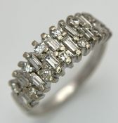 AN 18K WHITE GOLD, MIXED CUT, DIAMOND SET RING. 0.25CTW. 4.9G, SIZE M. JB 2007