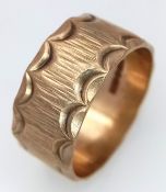A Vintage Hallmarked 9K Gold Band Ring. Decorative geometric pattern exterior. 9mm width. Size O.