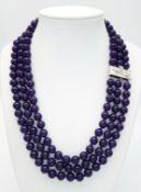 A Three Row Purple Jade Necklace. 8mm jade beads. 42-46 cm necklace length.