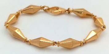 A Cleopatra 18K Yellow Gold Faceted Barrel Link Classic Bracelet. Approx 18.5cm length. Total